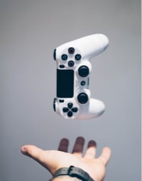 Image of hand throwing controller.