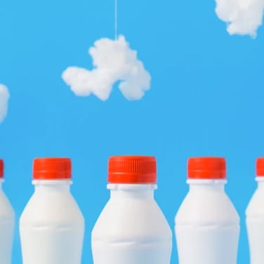 Illustration of milk bottles.